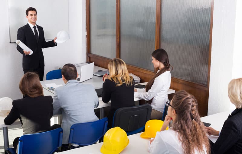 employees in a meeting to discuss workplace drug testing