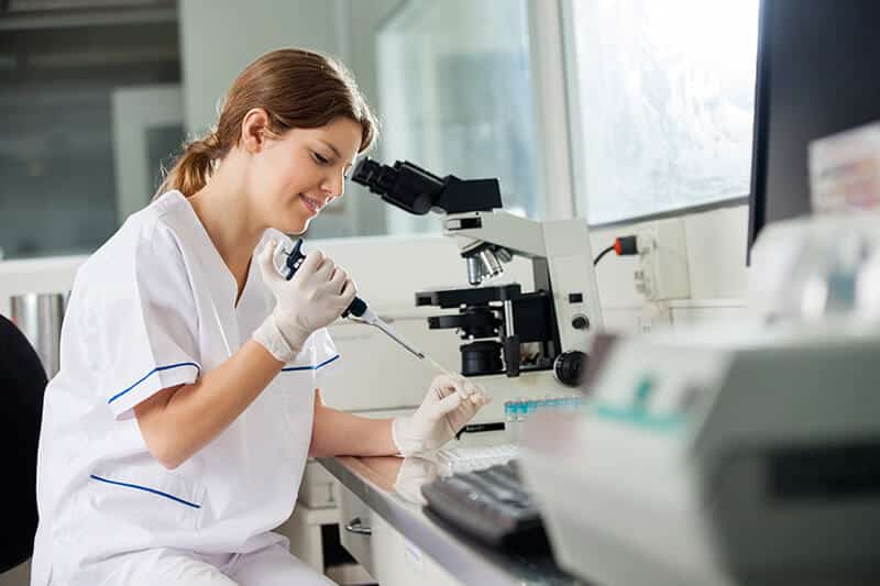 A woman working with test samples