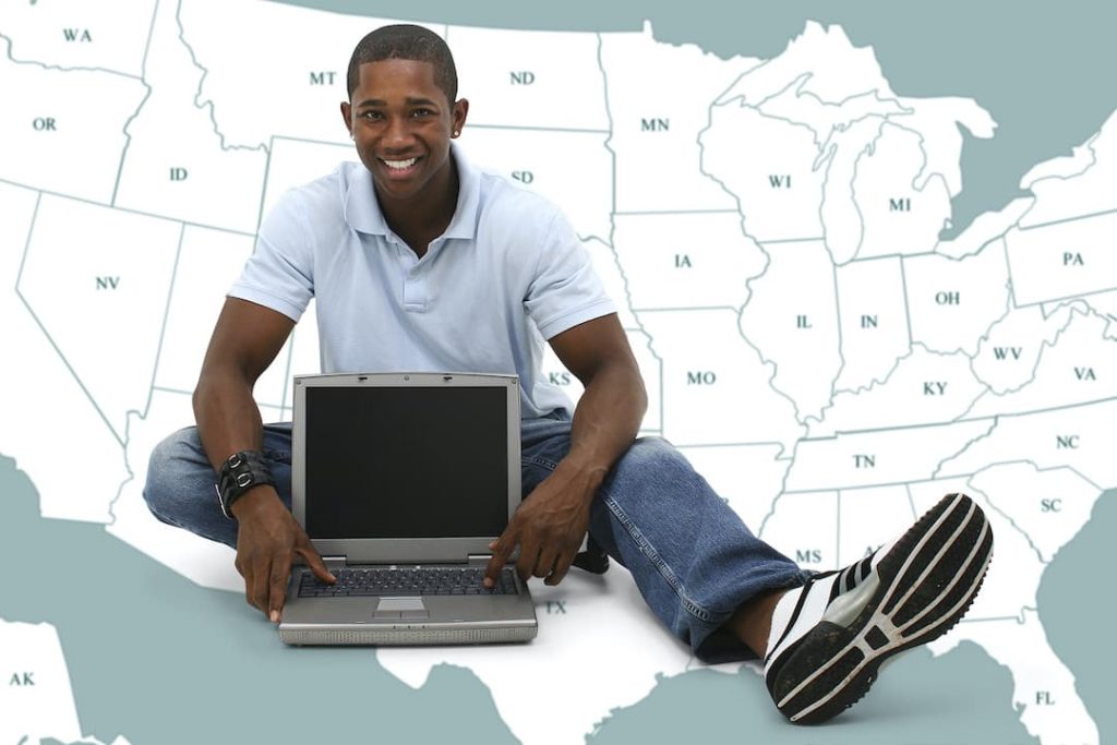 Man with a laptop in front of a map of the USA - Robust Drug Testing Software